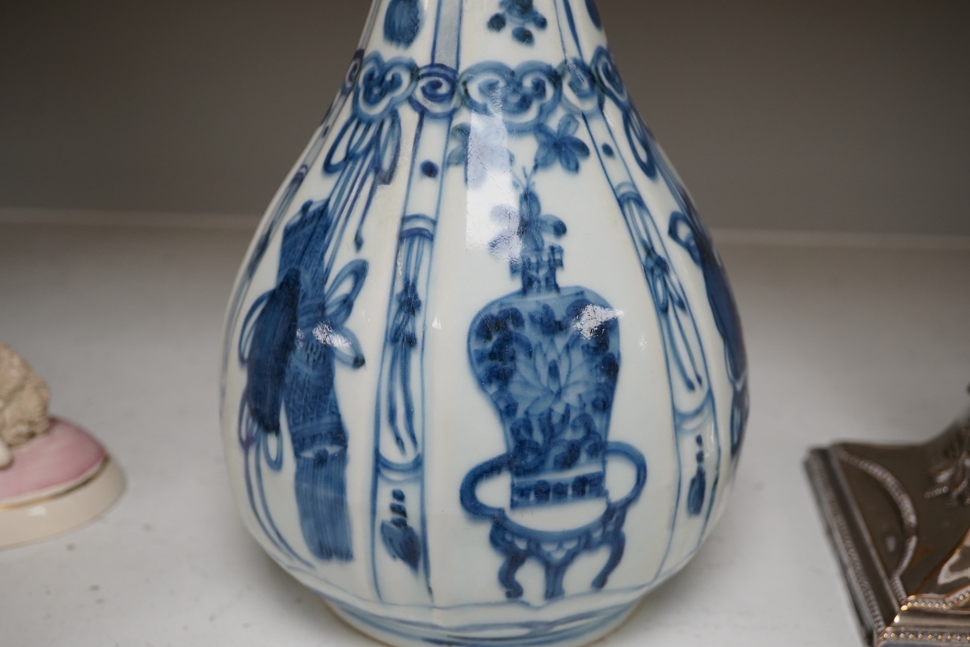 An early 17th century Chinese kraak blue and white bottle vase, 28.5cm. Condition - restored